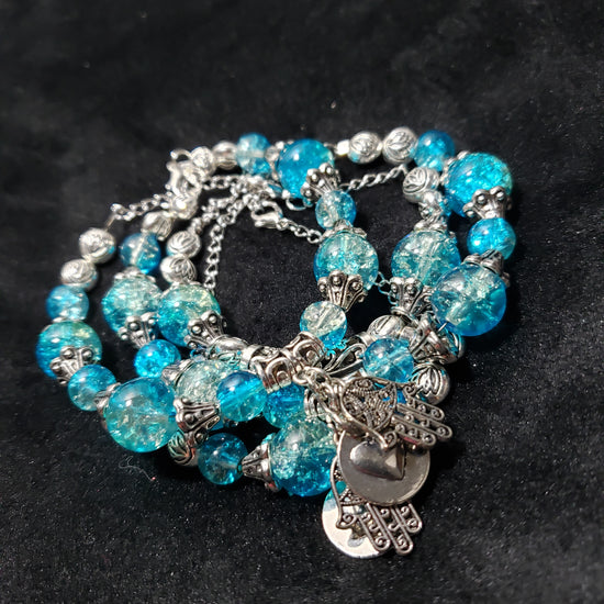 Blue Crackle beaded bracelet with silver charms