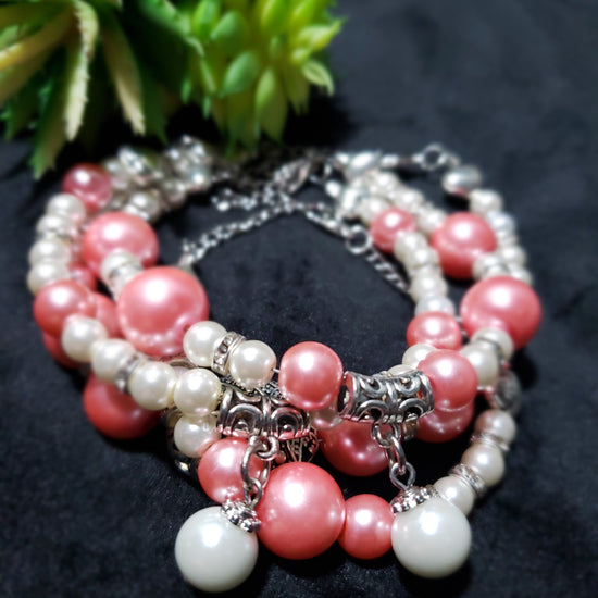 Pink and white beaded bracelets
